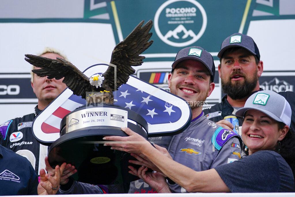 Matt Slocum Alex Bowman, center, driver of car 48, celebrates with his crew after winning the NASCAR Cup Series auto race at Pocono Raceway, Saturday, June 26, 2021, in Long Pond, Pa. (AP Photo/Matt Slocum)