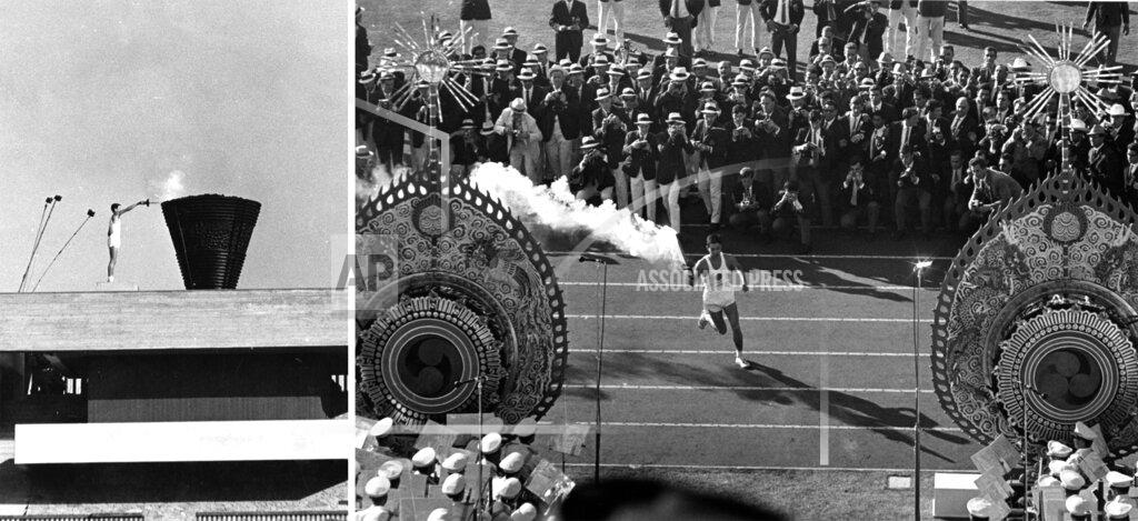 Uncredited Japanese runner Yoshinori Sakai runs with the Olympic torch to light the cauldron, right, during the opening ceremonies of the Summer Olympics in Tokyo, Oct. 10, 1964. (AP Photo)