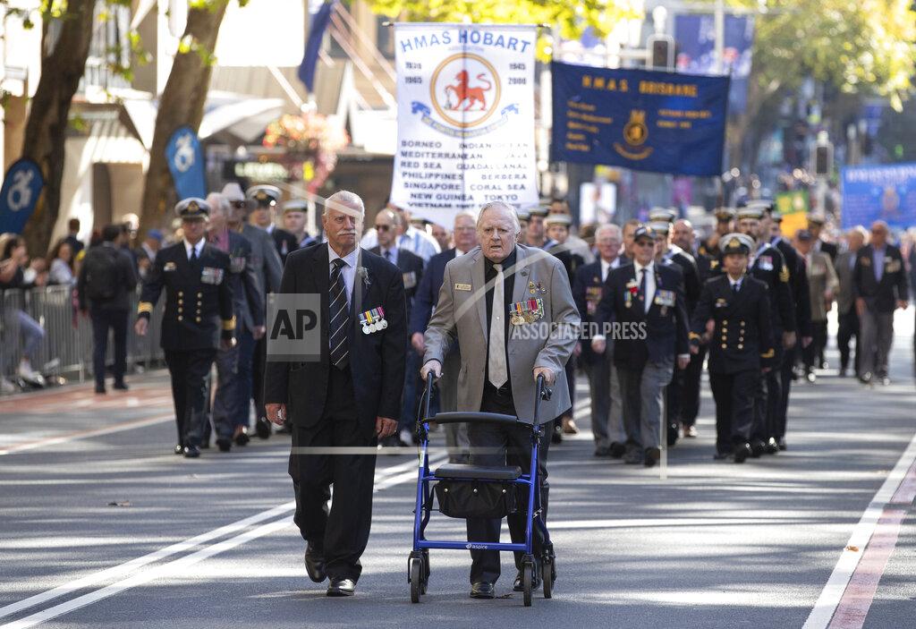 Mark Baker Veterans march during the Anzac Day parade in Sydney, Australia, Sunday, April 25, 2021. Australians and New Zealanders paid tribute to their war dead Sunday as both nations prepared to withdraw from their longest war in Afghanistan. (AP Photo/Mark Baker)