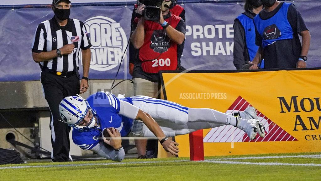 Rick Bowmer BYU quarterback Zach Wilson scores against Louisiana Tech during the first half of an NCAA college football game Friday, Oct. 2, 2020, in Provo, Utah. (AP Photo/Rick Bowmer, Pool)