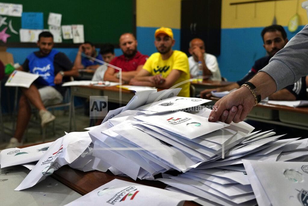 Bilal Hussein Election officials count ballots shortly after polling stations closed, in the northern city of Tripoli, Lebanon, Sunday, May 15, 2022. Lebanese voted for a new parliament Sunday against the backdrop of an economic meltdown that is transforming the country and low expectations that the election would significantly alter the political landscape. (AP Photo/Bilal Hussein)