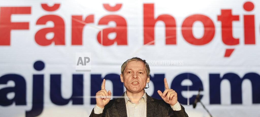 Vadim Ghirda FILE- In this May 24, 2019, file picture, Dacian Ciolos, former Romanian prime minister and EU commissioner for Agriculture, representing the 2020 USR PLUS alliance, addresses a European Parliament elections rally, in Bucharest, Romania. Ciolos is one of the leaders of the USR PLUS alliance. Romania will hold parliamentary elections on Dec. 6, 20330. Banner reads "Without thievery - We'll go far". (AP Photo/Vadim Ghirda, FIle)