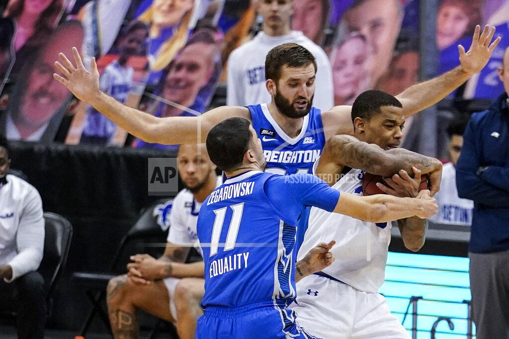 Frank Franklin Ii Creighton's Marcus Zegarowski (11) and Mitch Ballock (24) trap Seton Hall's Shavar Reynolds (33) during the second half of an NCAA college basketball game Wednesday, Jan. 27, 2021, in Newark, N.J. Creighton won 85-81. (AP Photo/Frank Franklin II)