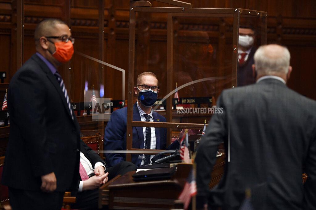 Jessica Hill State Rep. Jeff Currey, D-East Hartford, center, listens during session at the State Capitol, Monday, April 19, 2021. The Connecticut House of Representatives on Monday was expected to pass a contentious bill that would end the state's long-standing religious exemption from immunization requirements for schools. Panels were build around Currey's desk to help protect him after he had a kidney transplant in January of 2021. (AP Photo/Jessica Hill)