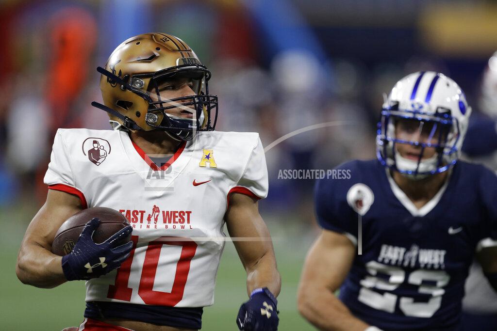 Chris O'meara East wide receiver Malcolm Perry, of Navy, (10) runs past West safety Austin Lee, of BYU, (23) for a touchdown during the second half of the East West Shrine football game Saturday, Jan. 18, 2020, in St. Petersburg, Fla. (AP Photo/Chris O'Meara)