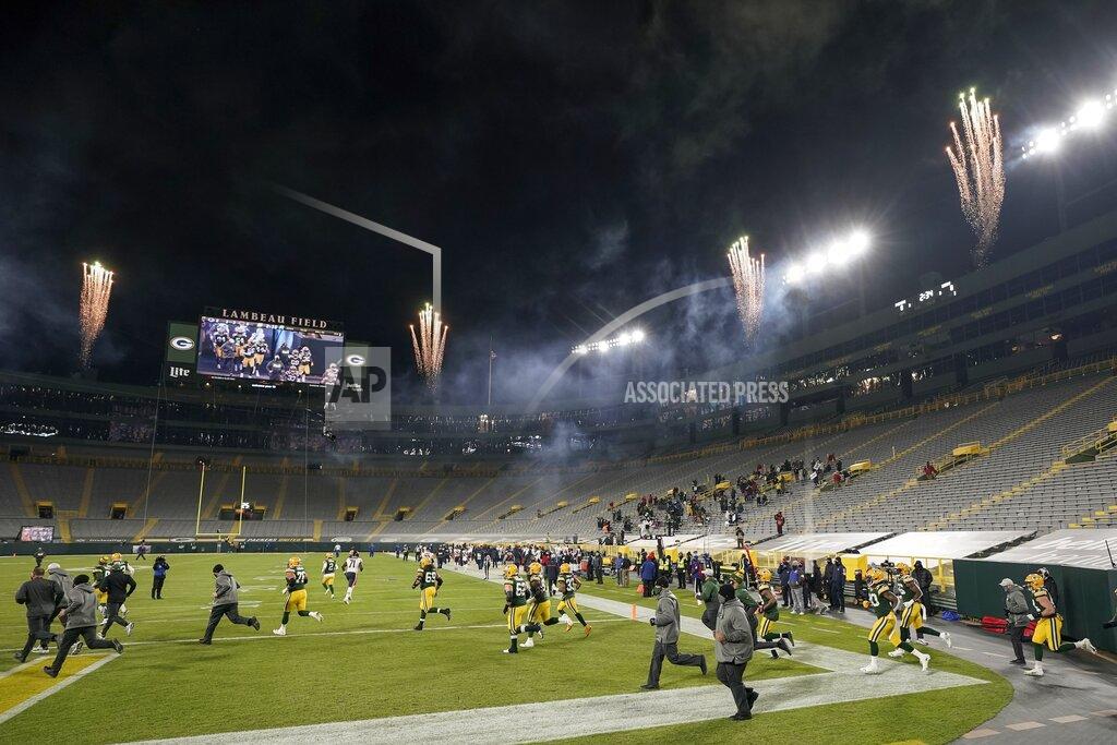 Morry Gash Green Bay Packers players take the field before an NFL football game against the Chicago Bears Sunday, Nov. 29, 2020, in Green Bay, Wis. (AP Photo/Morry Gash)