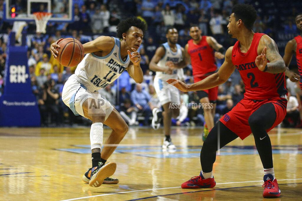 Stew Milne Rhode Island's Rhode Island's Jeff Dowtin (11) makes a move to the basket as Dayton's Ibi Watson (2) defends during the second half of an NCAA college basketball game Wednesday, March 4, 2020, in Kingston, R.I. (AP Photo/Stew Milne)