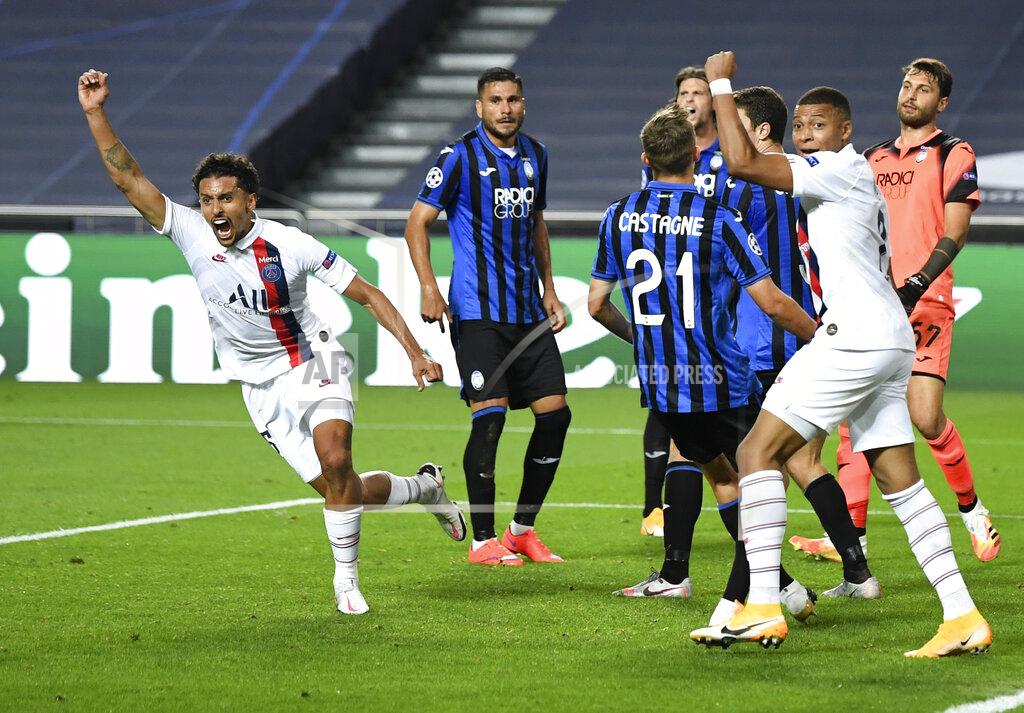 David Ramos PSG's Marquinhos, left, celebrates after scoring his team's first goal during the Champions League quarterfinal match between Atalanta and PSG at Luz stadium, Lisbon, Portugal, Wednesday, Aug. 12, 2020. (David Ramos/Pool Photo via AP)