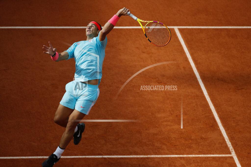 Christophe Ena Spain's Rafael Nadal plays a shot against Argentina's Diego Schwartzman in the semifinal match of the French Open tennis tournament at the Roland Garros stadium in Paris, France, Friday, Oct. 9, 2020. (AP Photo/Christophe Ena)