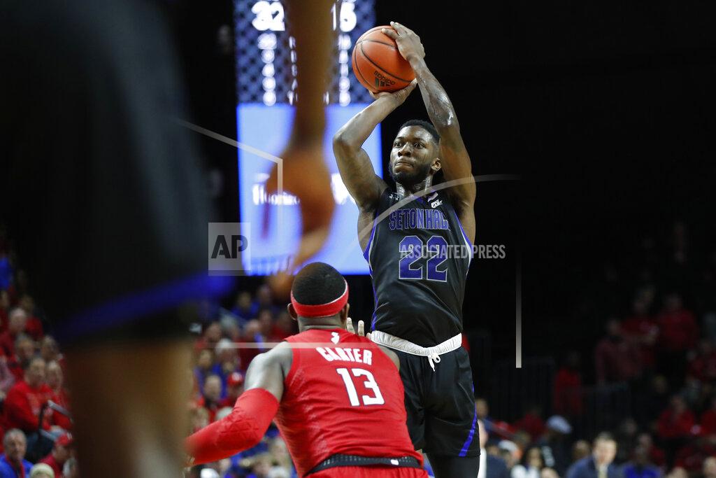 Kathy Willens Seton Hall guard Myles Cale (22) shoots with Rutgers forward Shaq Carter (13) watching from the floor during the first half of an NCAA college basketball game against Rutgers, Saturday, Dec. 14, 2019, in Piscataway, N.J. (AP Photo/Kathy Willens)
