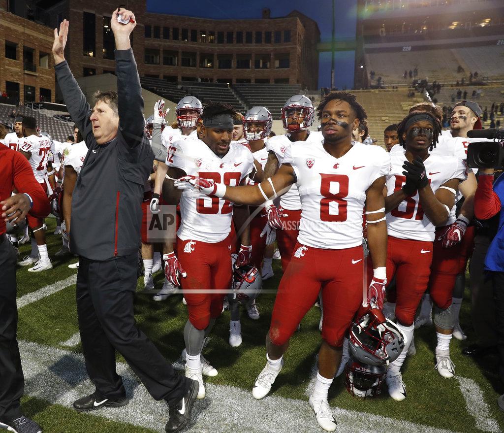 David Zalubowski Washington State head coach Mike Leach, front, acknowledges the crowd as his team assembles to sing the school song after an NCAA college football game against Colorado Saturday, Nov. 10, 2018, in Boulder, Colo. Washington State won 31-7. (AP Photo/David Zalubowski)