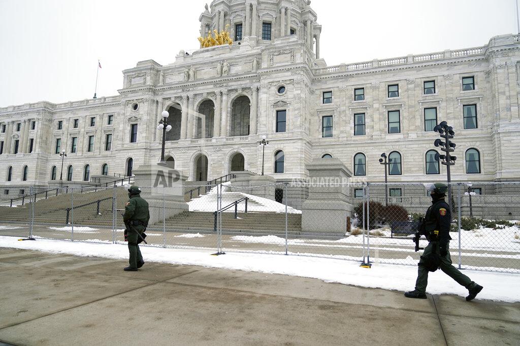 Minnesota Law Enforcement officers protect the Minnesota State Capitol Thursday, Jan. 7, 2021 in St. Paul, Minn., in the wake of the Electoral College protests Wednesday at the U.S. Capitol in Washington, D.C. (AP Photo/Jim Mone)