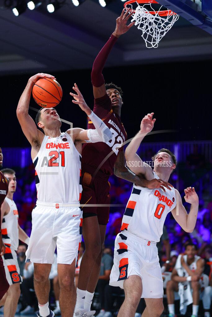 Tim Aylen In a photo provided by Bahamas Visual Services, Arizona State forward Alonzo Gaffney (32) and Syracuse forwards Cole Swider (21) and Jimmy Boeheim (0) try for a rebund during an NCAA college basketball game at Paradise Island, Bahamas, Thursday, Nov. 25, 2021. (Tim Aylen/Bahamas Visual Services via AP)