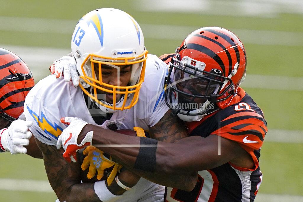 Bryan Woolston Los Angeles Chargers' Keenan Allen (13) is tackled by Cincinnati Bengals' William Jackson (22) during the second half of an NFL football game, Sunday, Sept. 13, 2020, in Cincinnati. (AP Photo/Bryan Woolston)