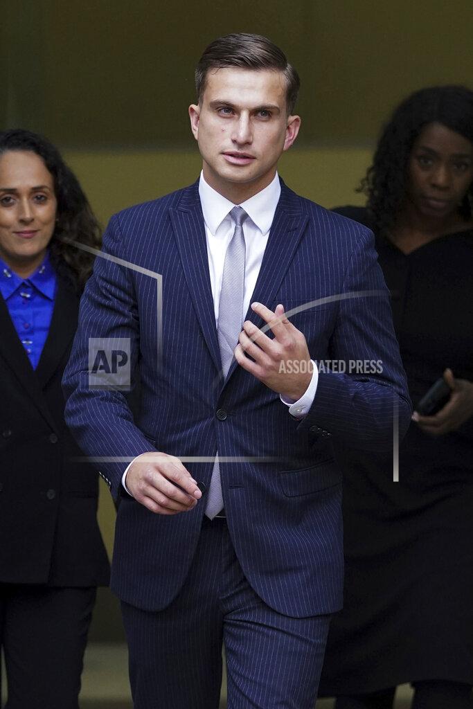 Kirsty O'COnnor Lewis Hughes leaves Westminster Magistrates' Court in London, Friday July 30, 2021, after he pleaded guilty to assault charges relating to harassment of Britain's Chief Medical Officer Chris Whitty. Lewis Hughes and another man filmed themselves harassing Chris Whitty in a London park, and Hughes has pleaded guilty to assault in court Friday. (Kirsty O'Connor/PA via AP)
