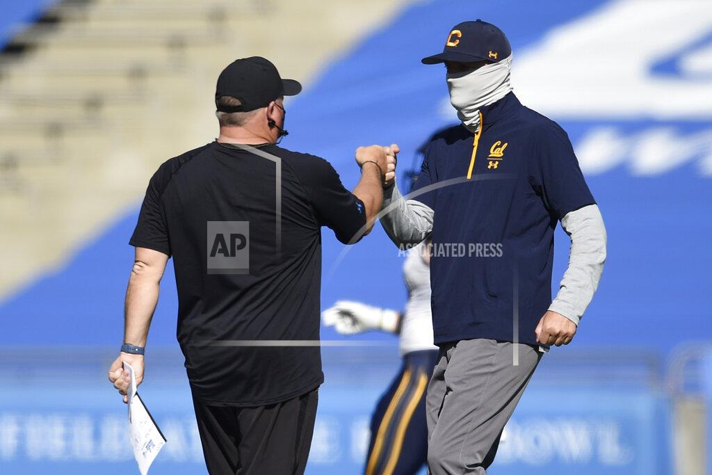 Kelvin Kuo UCLA head coach Chip Kelly, left, meets with California head coach Justin Wilcox after an NCAA college football game in Los Angeles, Sunday, Nov. 15, 2020. UCLA won 34-10. (AP Photo/Kelvin Kuo)