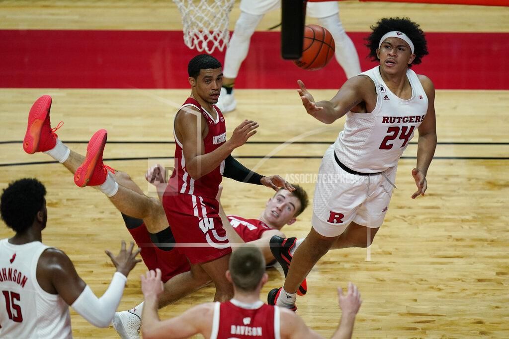 Seth Wenig Rutgers' Ron Harper Jr., right, throws up a shot during the second half of the team's NCAA college basketball game against Wisconsin, Friday, Jan. 15, 2021, in Piscataway, N.J. Wisconsin defeated Rutgers 60-54.(AP Photo/Seth Wenig)