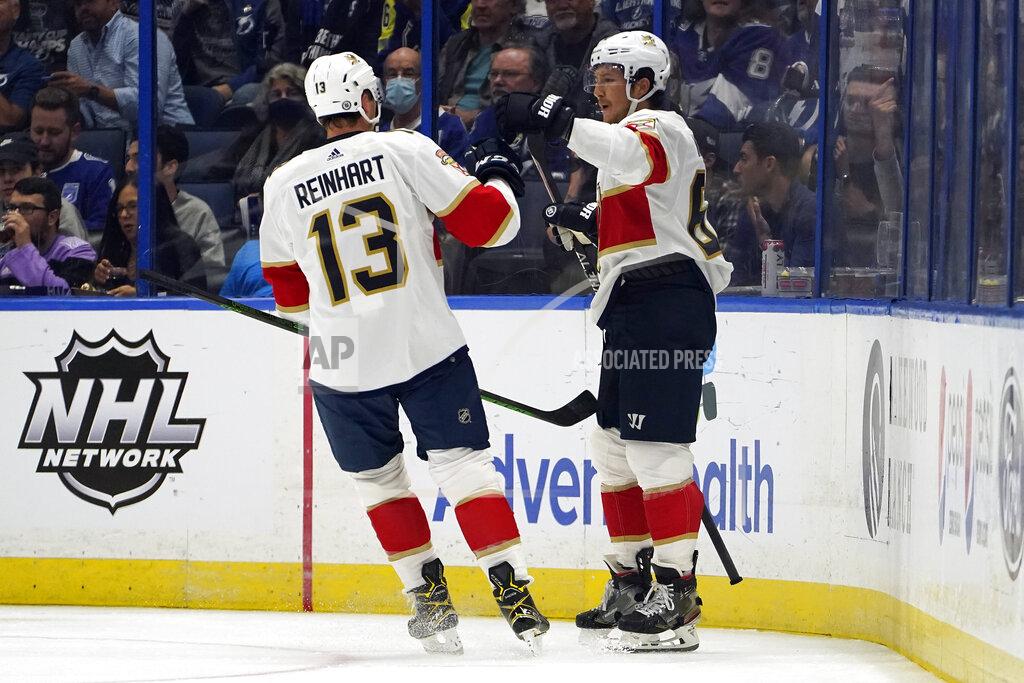 Chris O'MEara Florida Panthers defenseman Brandon Montour (62) celebrates his goal against the Tampa Bay Lightning with center Sam Reinhart (13) during the second period of an NHL hockey game Tuesday, Oct. 19, 2021, in Tampa, Fla. (AP Photo/Chris O'Meara)