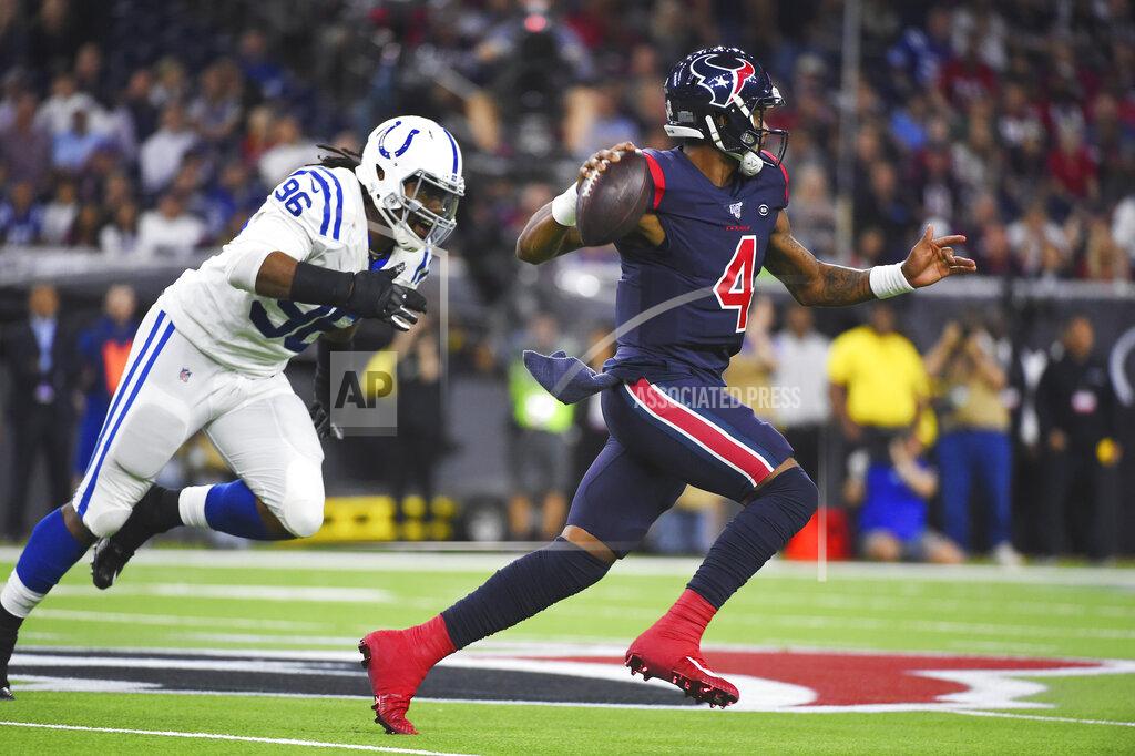 Eric Christian Smith Houston Texans quarterback Deshaun Watson (4) looks to throw as he is chased by Indianapolis Colts defensive tackle Denico Autry (96) during the first half of an NFL football game Thursday, Nov. 21, 2019, in Houston. (AP Photo/Eric Christian Smith)
