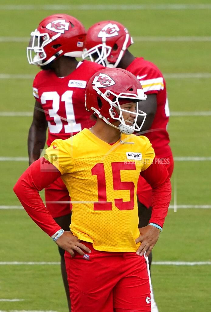 Ed Zurga Kansas City Chiefs quarterback Patrick Mahomes (15) waits to run drills during the team's NFL football training camp Saturday, July 31, 2021, in St. Joseph, Mo. (AP Photo/Ed Zurga)