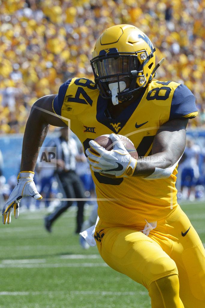 Craig Hudson West Virginia tight end Jovani Haskins (84) runs in for a touchdown during the first half of an NCAA college football game against Kansas in Morgantown, W. Va., Saturday Oct. 6, 2018. (Craig Hudson/Charleston Gazette-Mail via AP)