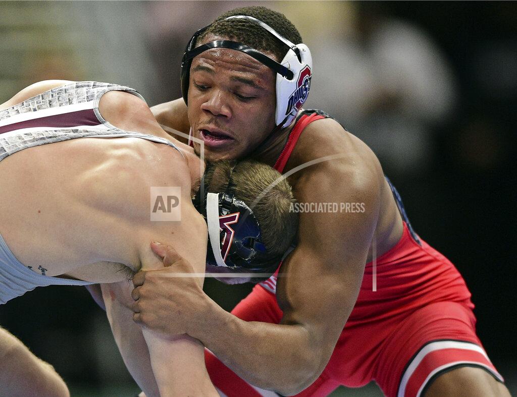 David Dermer FILE - In this March 16, 2018, file photo, Ohio State's Myles Martin, right, works against Virginia Tech's Zachary Zavatsky during a bout at 184 pounds at the NCAA Division I Wrestling Championships in Cleveland. Martin, who won the Big Ten title, is expected to contended at the NCAA Division I Wrestling Championships. (AP Photo/David Dermer, File)