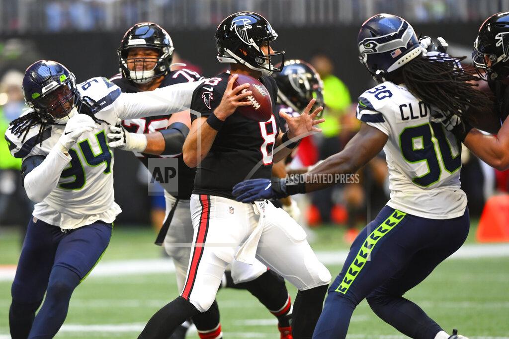 John Amis Atlanta Falcons quarterback Matt Schaub (8) works under pressure from the Seattle Seahawks in the pocket during the second half of an NFL football game, Sunday, Oct. 27, 2019, in Atlanta. The Seattle Seahawks won 27-20. (AP Photo/John Amis)