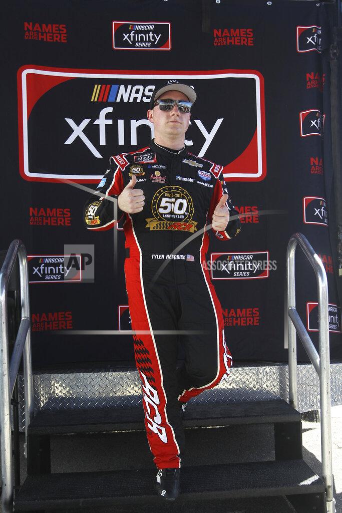 Luis M. Alvarez Tyler Reddick poses after winning the pole position for the NASCAR Xfinity Series auto racing championship at Homestead-Miami Speedway in Homestead, Fla. Saturday, Nov. 16, 2019. (AP Photo/Luis M. Alvarez)