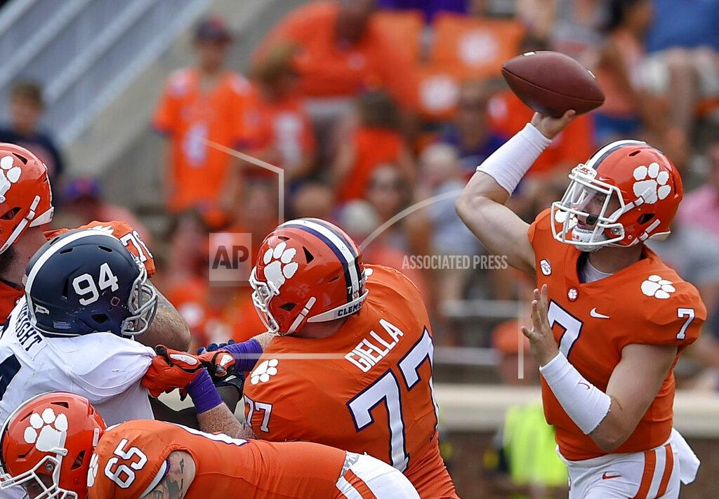 Richard Shiro FILE - In this Sept. 15, 2018, file photo, Clemson quarterback Chase Brice delivers a pass as Zach Giella (77) blocks during the second half of an NCAA college football game in Clemson, S.C. Clemson tight end Braden Galloway and offensive lineman Zach Giella will miss next season after an NCAA panel rejected the school's appeal of their drug suspension. Clemson athletic spokesman Jeff Kallin said the school learned of the NCAA's decision on Wednesday, May 22, 2019. (AP Photo/Richard Shiro, File)