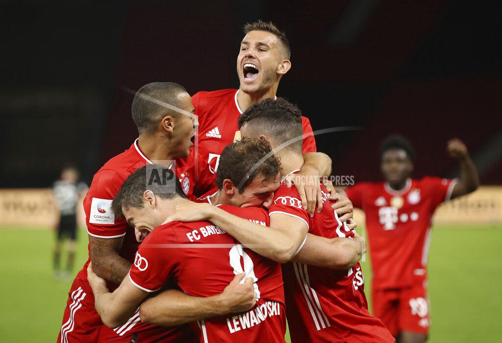 Alexander Hassenstein Munich's Robert Lewandowski , center bottom, celebrates with teammates after scoring his team's fourth goal during the DFB Cup final match between Bayer 04 Leverkusen and FC Bayern Muenchen at Olympiastadion in Berlin, Germany, Saturday, July 4, 2020. (Photo by Alexander Hassenstein/Pool via AP)