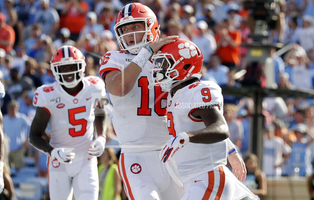Chris Seward Clemson's Travis Etienne (9) celebrates his touchdown with Trevor Lawrence (16) and Tee Higgins (5) during the second quarter of an NCAA college football game against North Carolina in Chapel Hill, N.C., Saturday, Sept. 28, 2019. (AP Photo/Chris Seward)