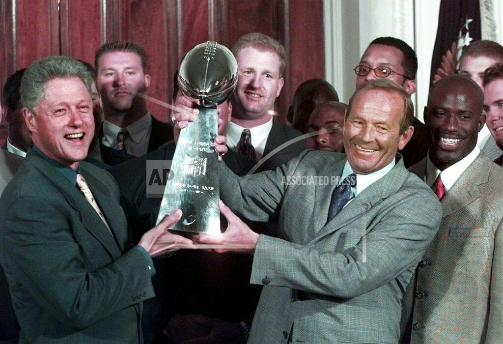 Greg Gibson FILE - In this June 16, 1998, file photo, then-President Clinton, left, and Denver Broncos owner Pat Bowlen hold the Vince Lombardi Trophy during a ceremony at the White House where the president honored the Super Bowl XXXII champions. The late Pat Bowlen will be inducted into the Pro Football Hall of Fame in Canton, Ohio on Aug. 3, 2019.(AP Photo/Greg Gibson, File)