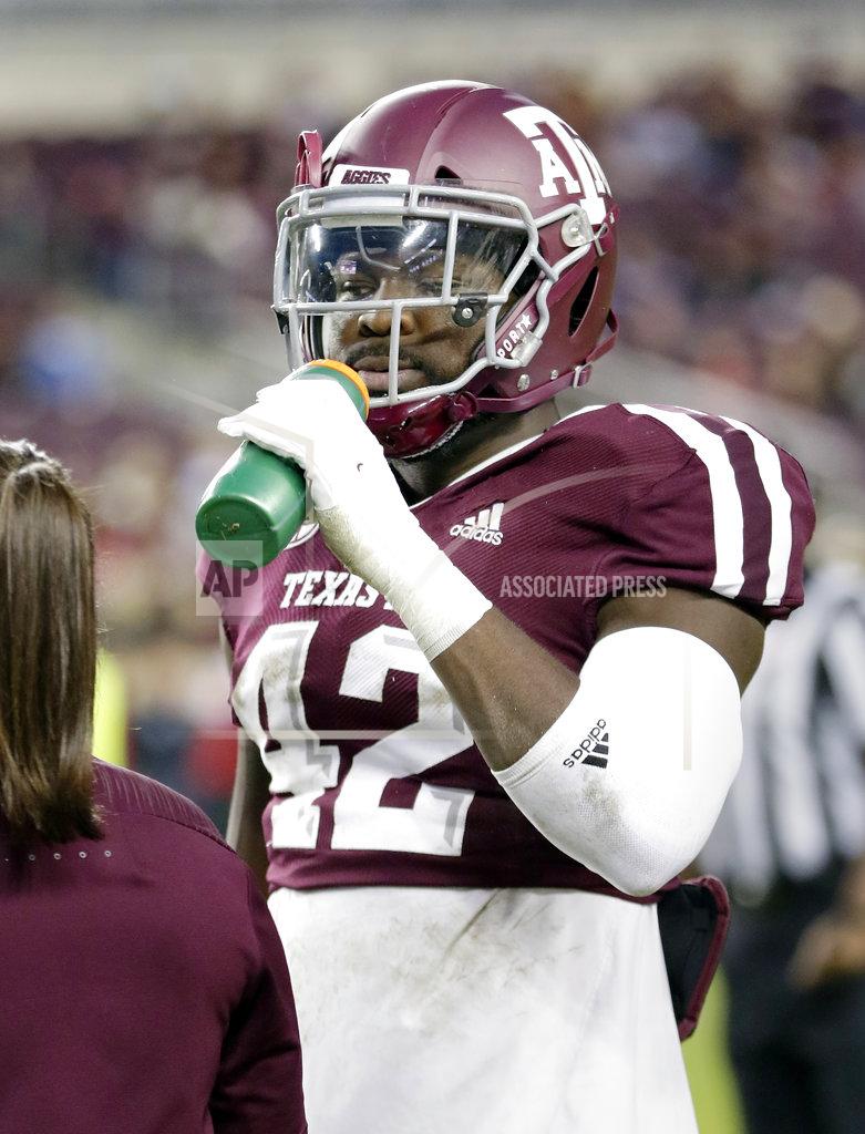 Michael Wyke Texas A&M linebacker Otaro Alaka (42) drinks before an NCAA college football game against UAB Saturday, Nov. 17, 2018, in College Station, Texas. (AP Photo/Michael Wyke)