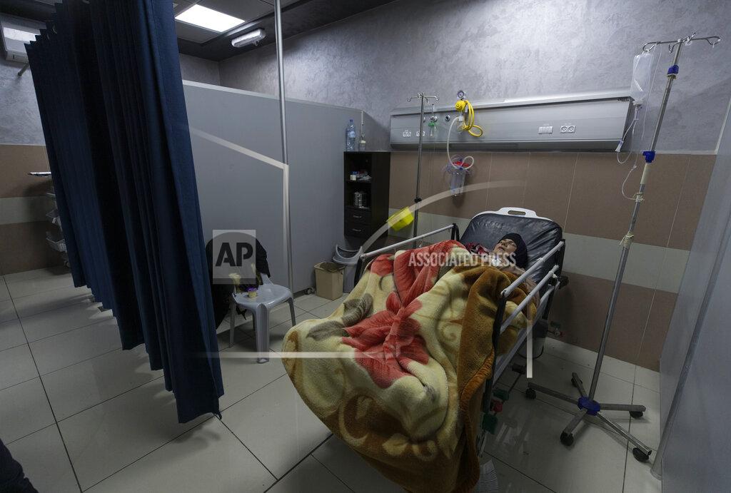 Nasser Nasser A Palestinian patient infected with COVID-19 lies under medical observation at the emergency unit, in the Palestine Medical Complex, in the West Bank city of Ramallah, Thursday, Jan. 28, 2021. (AP Photo/Nasser Nasser)