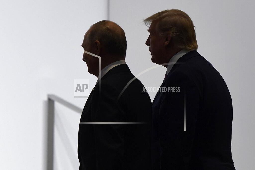 Susan Walsh FILE - In this June 28, 2019, file photo, President Donald Trump and Russian President Vladimir Putin walk to participate in a group photo at the G20 summit in Osaka, Japan. The Trump administration is notifying international partners that it is pulling out of a treaty that permits 30-plus nations to conduct unarmed, observation flights over each other’s territory — overflights set up decades ago to promote trust and avert conflict. The administration says it wants out of the Open Skies Treaty because Russia is violating the pact and imagery collected during the flights can be obtained quickly at less cost from U.S. or commercial satellites. (AP Photo/Susan Walsh, File)