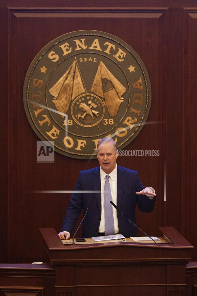 Wilfredo Lee Florida Senate President Wilton Simpson talks to senators near the end of a legislative session, Friday, April 30, 2021, at the Capitol in Tallahassee, Fla. (AP Photo/Wilfredo Lee)