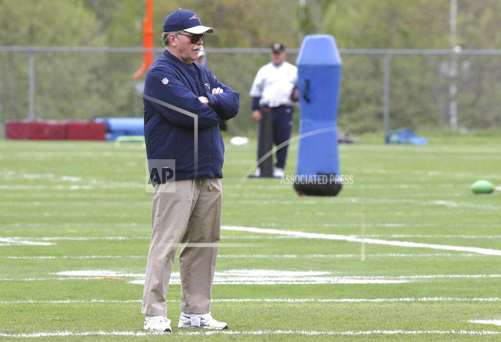 Charles Krupa FILE — Ernie Adams, football research director for the New England Patriots, watches during NFL football practice, in Foxborough, Mass., in this Thursday, May 23, 2019 file photo. Adams, a former high school classmate of coach Bill Belichick, participated in his final practice with the team Wednesday, June 16, 2021. Adams retired from his job at the Patriots, Wednesday, June 16, after 21 years with the team. (AP Photo/Charles Krupa, File)