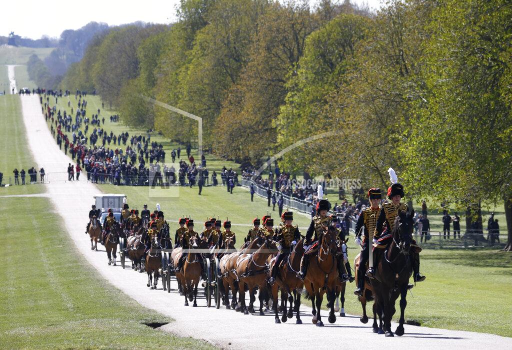 Phil Noble Officers of The King's Troop Royal Horse Artillery arrive for the Gun Salute for the funeral of Britain's Prince Philip at Windsor Castle in Windsor, England Saturday, April 17, 2021. Prince Philip died April 9 at the age of 99 after 73 years of marriage to Britain's Queen Elizabeth II. (Phil Noble/Pool via AP)