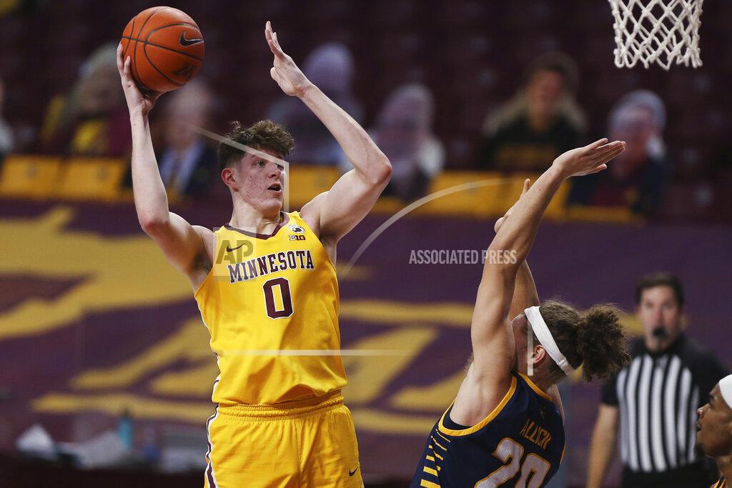 Stacy Bengs Minnesota center Liam Robbins (0) shoots over UMKC forward Josiah Allick (20) during the first half of an NCAA college basketball game Thursday, Dec. 10, 2020, in Minneapolis. (AP Photo/Stacy Bengs)