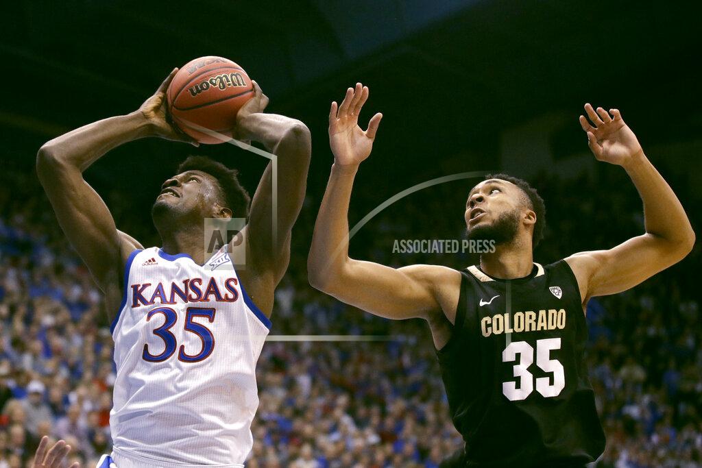Charlie Riedel Kansas' Udoka Azubuike gets past Colorado's Dallas Walton to shoot during the first half of an NCAA college basketball game Saturday, Dec. 7, 2019, in Lawrence, Kan. (AP Photo/Charlie Riedel)