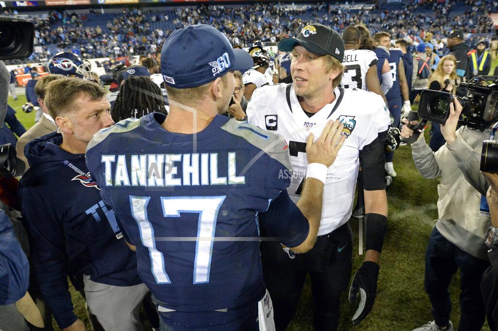 Mark Zaleski Tennessee Titans quarterback Ryan Tannehill (17) meets with Jacksonville Jaguars quarterback Nick Foles after an NFL football game Sunday, Nov. 24, 2019, in Nashville, Tenn. The Titans won 42-20. (AP Photo/Mark Zaleski)