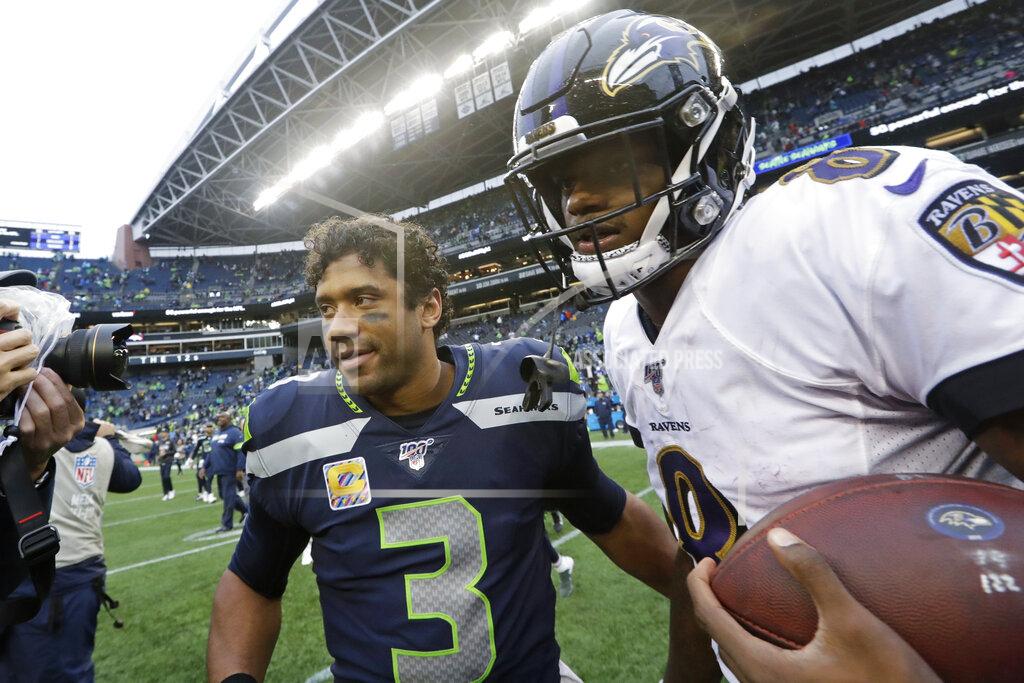 Elaine Thompson Baltimore Ravens quarterback Lamar Jackson, right, talks with Seattle Seahawks quarterback Russell Wilson (3) after an NFL football game, Sunday, Oct. 20, 2019, in Seattle. (AP Photo/Elaine Thompson)