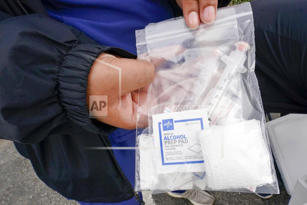 Two syringes filled with the Johnson & Johnson's one-dose COVID-19 vaccine are seen at the Vaxmobile, at the Uniondale Hempstead Senior Center, Wednesday, March 31, 2021, in Uniondale, N.Y. The Vaxmobile, is a COVID-19 mobile vaccination unit, sponsored by a partnership between Mount Sinai South Nassau and Town of Hempstead to bring the one-dose vaccine directly to hard-hit communities in the area. (AP Photo/Mary Altaffer)