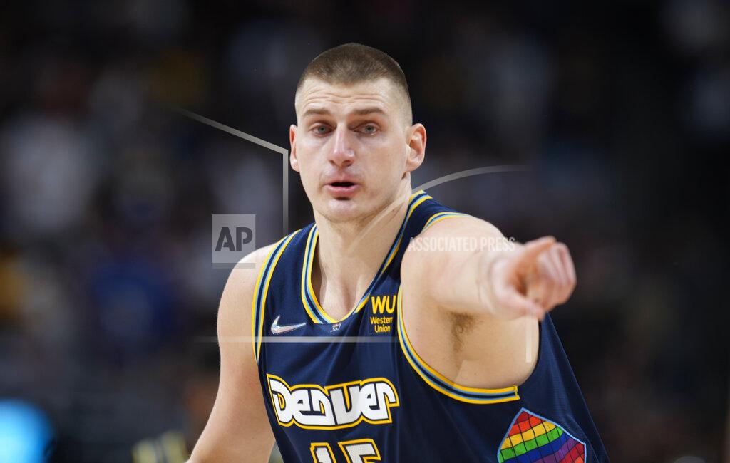 David Zalubowski FILE - Denver Nuggets center Nikola Jokic gestures after hitting a 3-point basket against the Golden State Warriors in the first half of Game 4 of an NBA basketball first-round Western Conference playoff series on April 24, 2022, in Denver. Jokic has earned a second straight NBA Most Valuable Player trophy to become the second consecutive international player to win two in a row. The 27-year-old from Serbia averaged 27.1 points, 13.8 rebounds and 7.9 assists. (AP Photo/David Zalubowski, File)