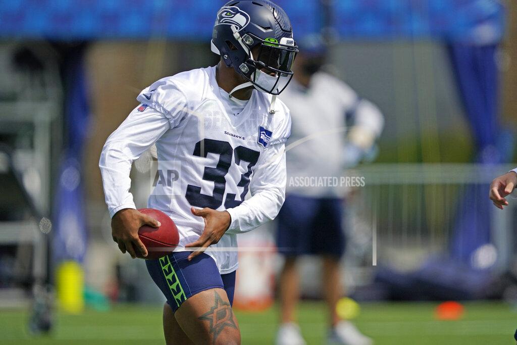 Ted S. Warren Seattle Seahawks safety Jamal Adams holds the football during a practice drill at NFL football training camp, Wednesday, Aug. 12, 2020, in Renton, Wash. (AP Photo/Ted S. Warren, Pool)