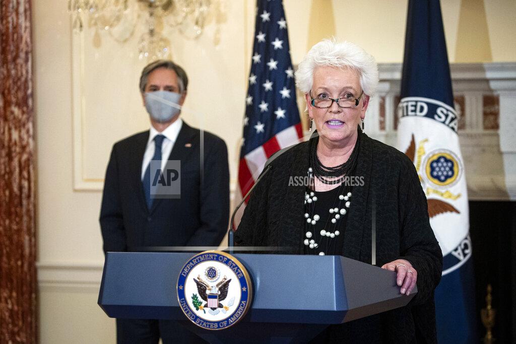 Al Drago Gayle Smith, the new State Department Coordinator for Global COVID-19 Response and Health Security, speaks about U.S. leadership in fighting the coronavirus pandemic at the State Department in Washington, Monday, April 5, 2021, as Secretary of State Antony Blinken listens. (Al Drago/Pool via AP)