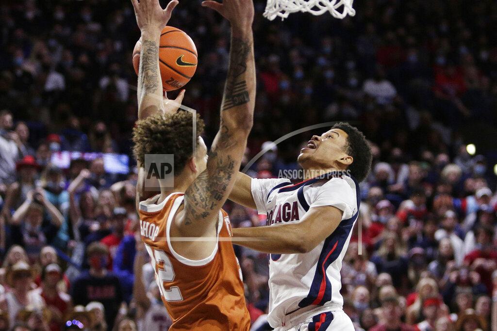 Young Kwak Gonzaga guard Rasir Bolton, right, shoots while pressured by Texas forward Christian Bishop during the first half of an NCAA college basketball game Saturday, Nov. 13, 2021, in Spokane, Wash. (AP Photo/Young Kwak)