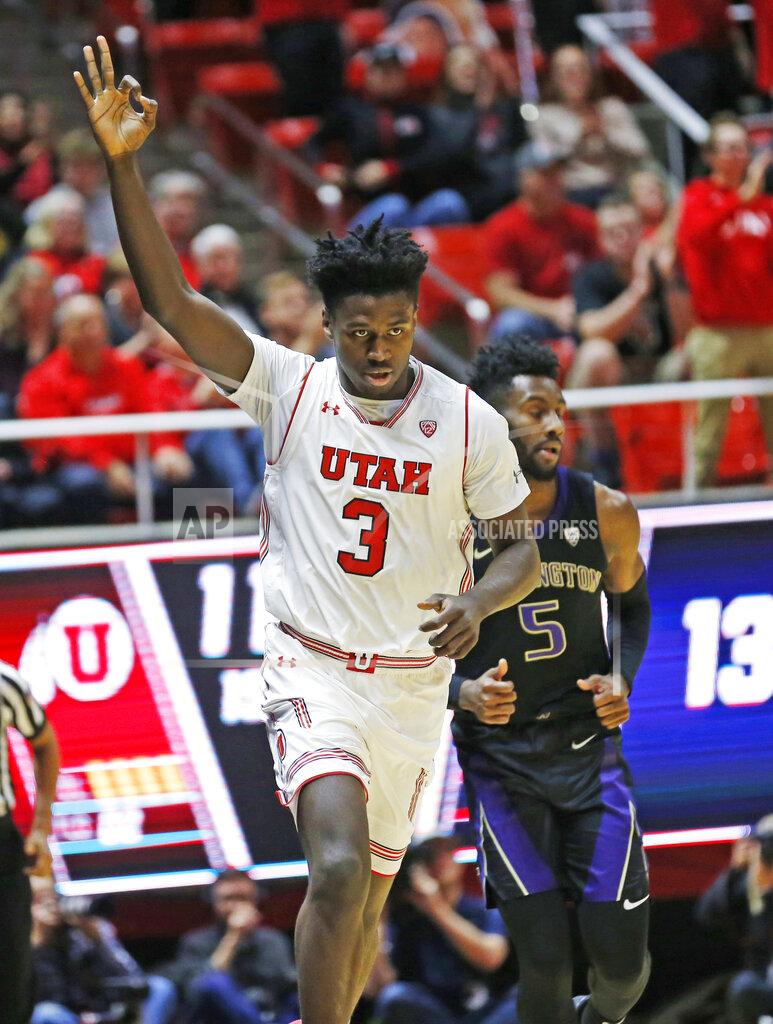 Rick Bowmer Utah forward Donnie Tillman (3) celebrates after scoring a 3-pointer on Washington guard Jaylen Nowell (5) during the first half of an NCAA college basketball game Thursday, Jan., 10, 2019, in Salt Lake City. (AP Photo/Rick Bowmer)