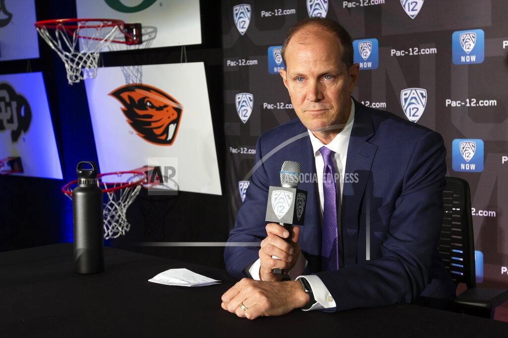 D. Ross Cameron Washington head coach Mike Hopkins speaks during the Pac-12 NCAA college basketball media day, in San Francisco, Tuesday, Oct. 8, 2019. (AP Photo/D. Ross Cameron)