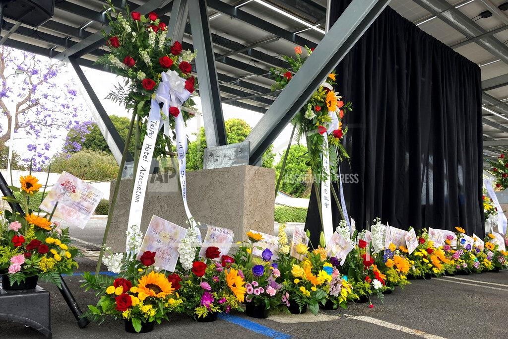 Amy Taxin Flower bouquets are displayed as a memorial to victim's of Sunday's shooting as survivors and church leaders join in prayer and thank community members for their support nearly a week after a deadly shooting at a Taiwanese American church congregation Saturday, May 21, 2022, in Laguna Woods, Calif. The community is reeling after the attack on a luncheon of the Irvine Taiwanese Presbyterian Church that killed one and wounded five. (AP Photo/Amy Taxin)